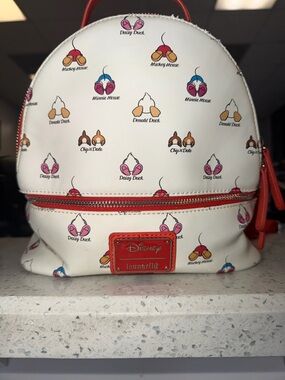 Loungefly White Mini Backpack with Red Trim and Multicolor Character Icons